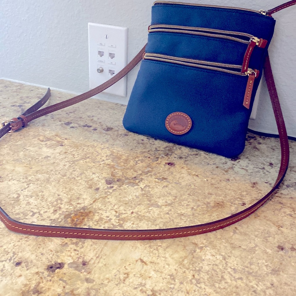 Dooney & Bourke Navy Three Zipper Crossbody Purse with Leather Adjustable Strap.